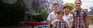 Good Shepherd Hoxton Park students standing on school grounds